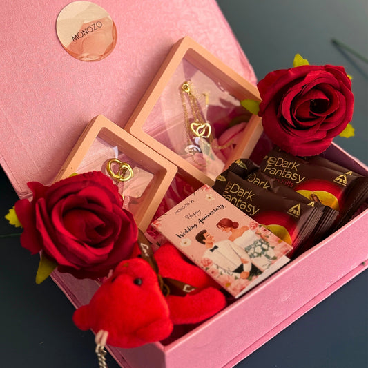 Anniversary Gift Hamper (2 Jewellery Sets, 1 Teddy Key Ring, Choco Cookies, 2 Roses, Anniversary Wish Card)